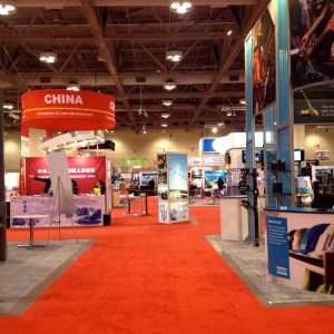 Aisle of the PDAC with exhibitors from different country like China